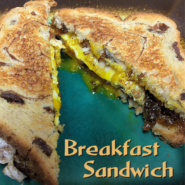 This Breakfast Sandwich by Foodie Home Chef is the perfect way to start your day off right! I created this sandwich after dreaming about it one night. Thankfully, I remembered it when I woke up, wrote it down & made it... it tasted just as great as I imagined it would. It's salty & sweet, easy to prepare & oozing with yummyness! Breakfast Sandwich | Breakfast Recipes | Breakfast | Sandwich Recipes | Sandwiches | Comfort Food | #foodiehomechef @foodiehomechef